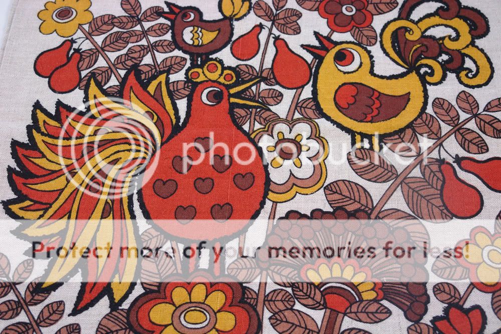 detail of teatowel with bird decoration