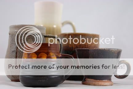 group of hand thrown pottery mugs