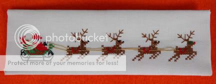 Cross stitch of Father Christmas and reindeer